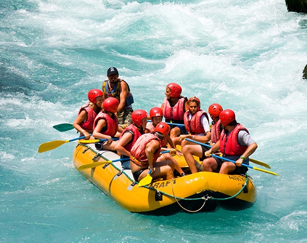 People white water rafting.