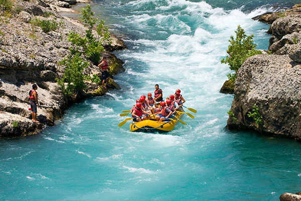 People white water rafting.